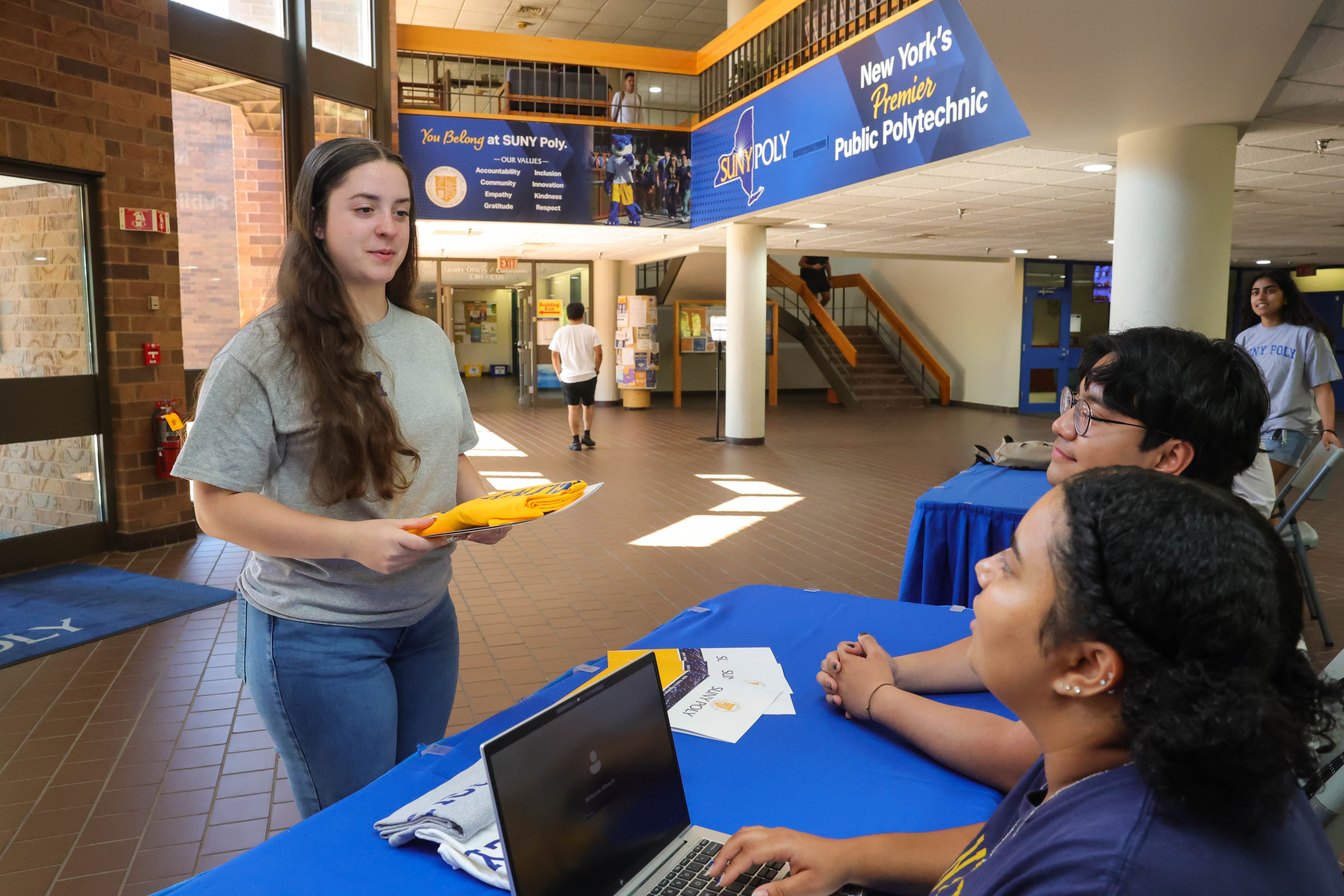 A visiting student checking in with our student ambassadors for a SUNY Poly campus tour