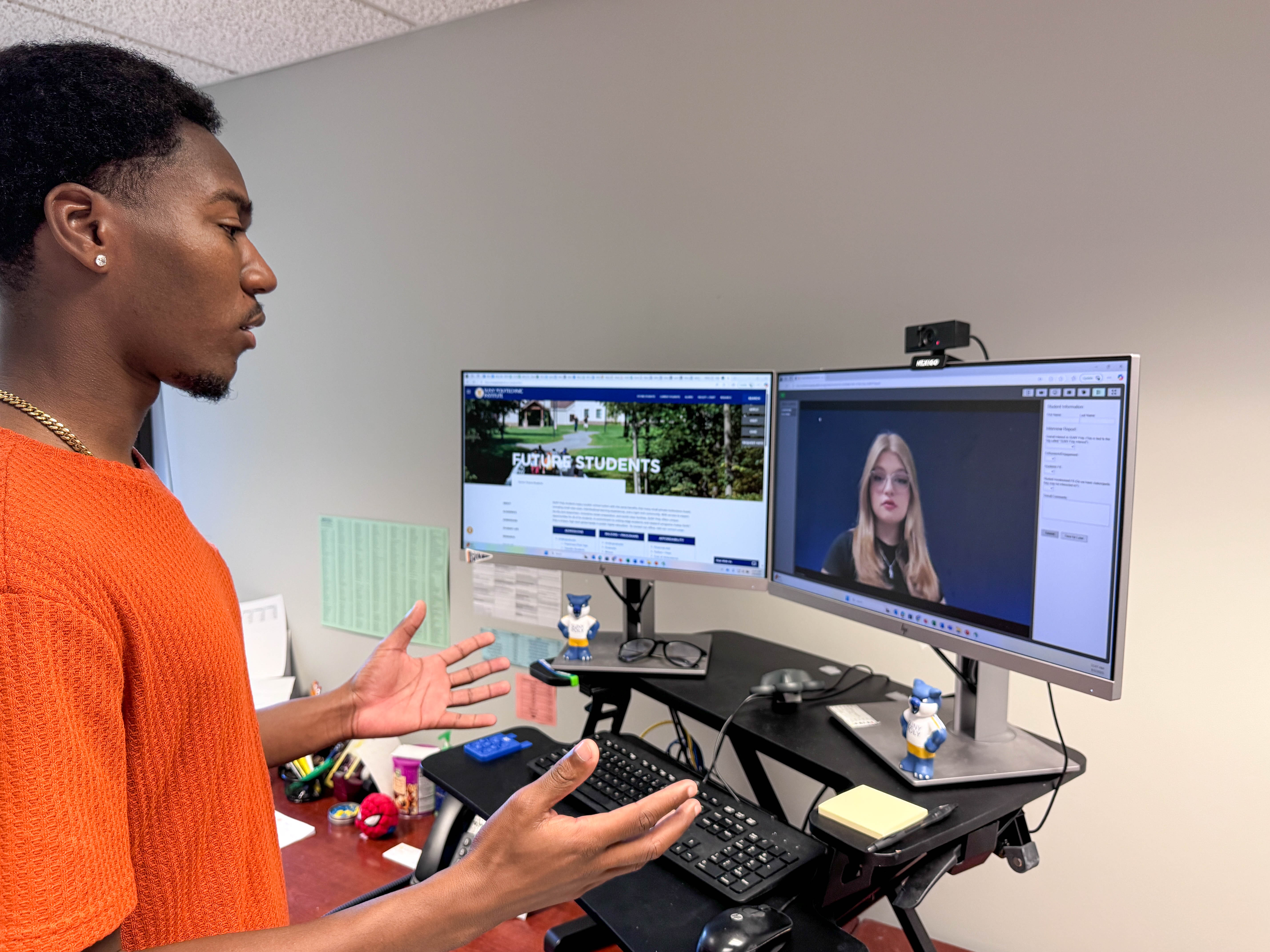 A SUNY Poly admissions counselor having a video conference with an accepted student